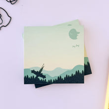 Load image into Gallery viewer, Stack of scenic notepads of Endor with a pen and paper clips on a light background