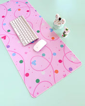 Load image into Gallery viewer, Pink desk mat with colorful patterns on a light green background