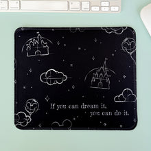 Load image into Gallery viewer, Black mouse pad with white designs and text on a light green surface with a keyboard.
