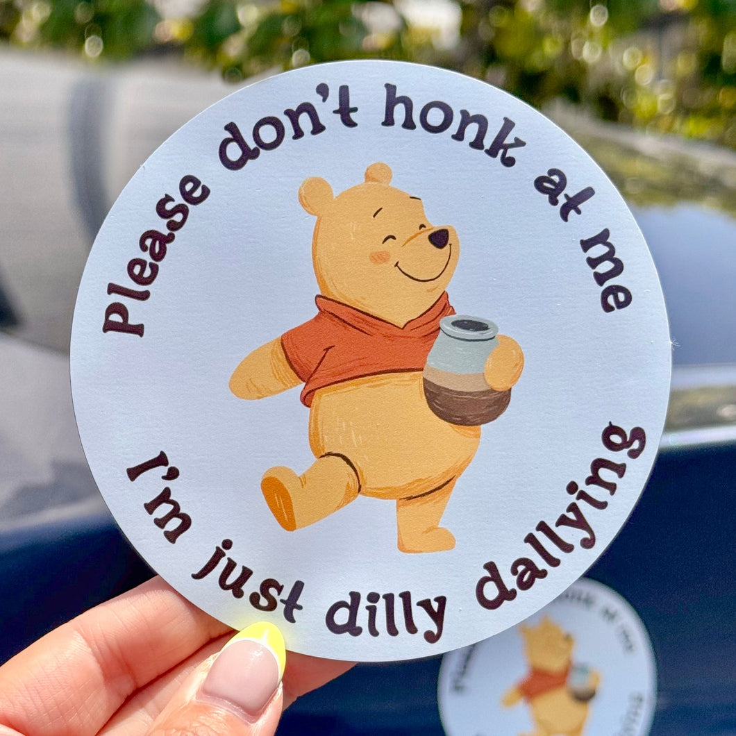 Car magnet with cartoon bear holding a can, text 'Please don't honk at me I'm just dilly dallying', with a pot of honey
