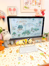 Load image into Gallery viewer, Desk setup with a computer monitor displaying a cartoon map, surrounded by plush toys and decorative items.

