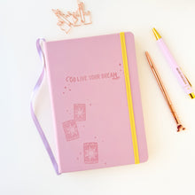 Load image into Gallery viewer, Pink notebook with &#39;Go Live Your Dream&#39; text, Floating Lanterns embossed, rose gold pen, and paper clips on a light background
